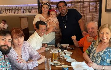 Gustavo Mendes with his parents and siblings and daughter